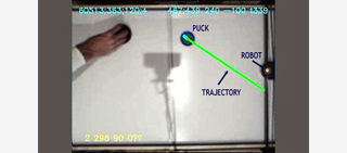 Illustration for article titled This robot will utterly destroy you at air hockey